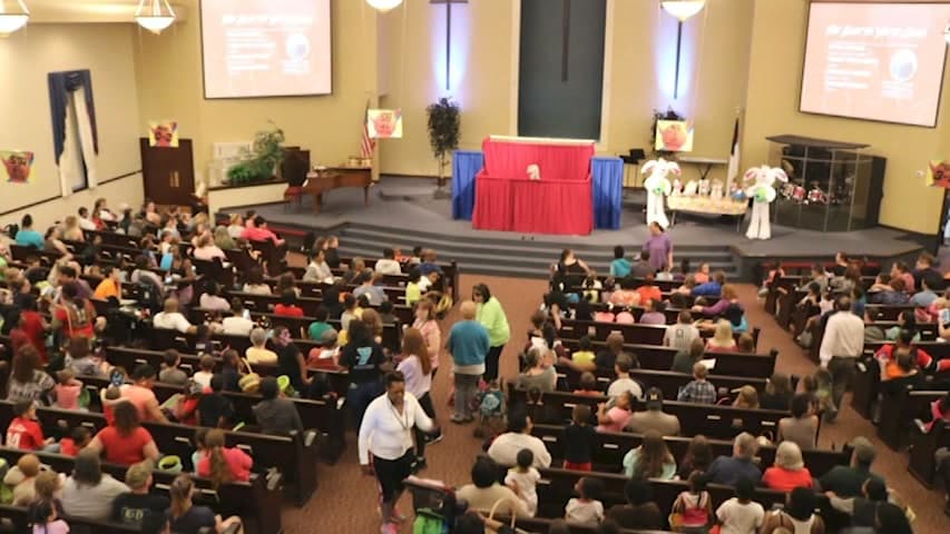 Families filling the sanctuary for the Easter Egg Hunt.